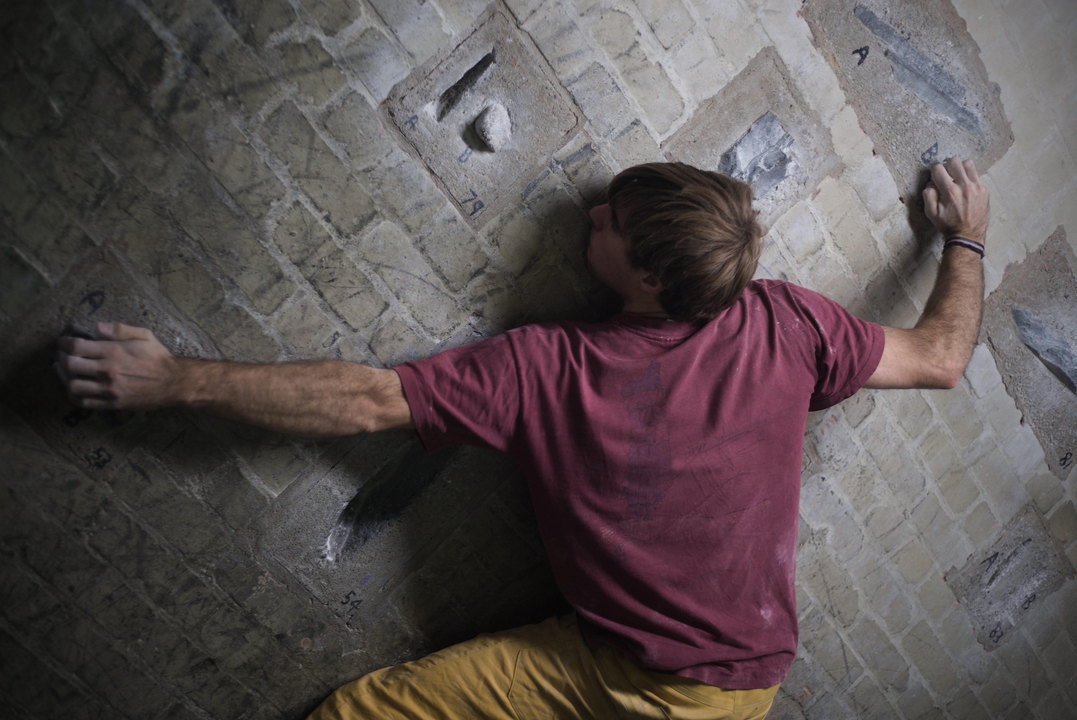 climber climbing on the iffley wall