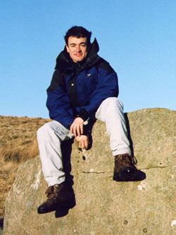 Jon Prag sitting on a rock