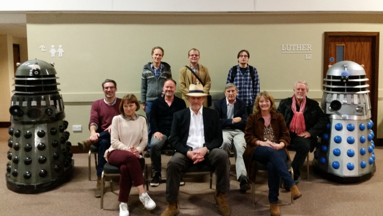 Ian, James, and Adam with Paul Marc Davis, Janet Fielding, David Hankinson, Peter Davison, Peter Roy, Sarah Sutton, and Roger Murray-Leach at Bedford Who Charity Convention 6 in 2021